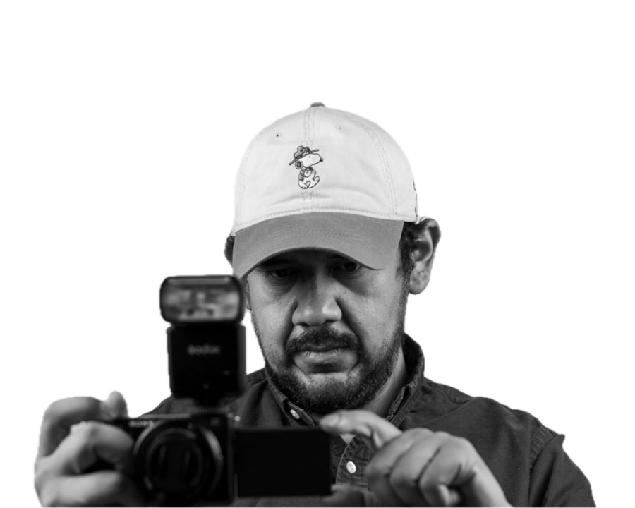 Lazaro of Brownsview Media composing a photograph with his camera