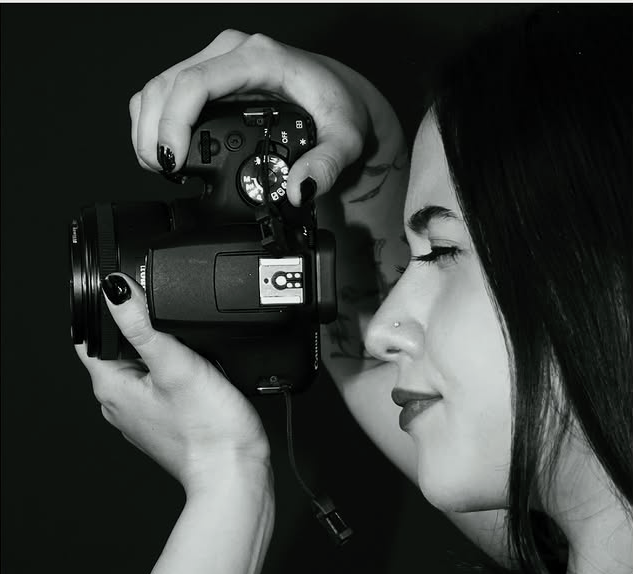 Close profile of Nadine composing a photograph