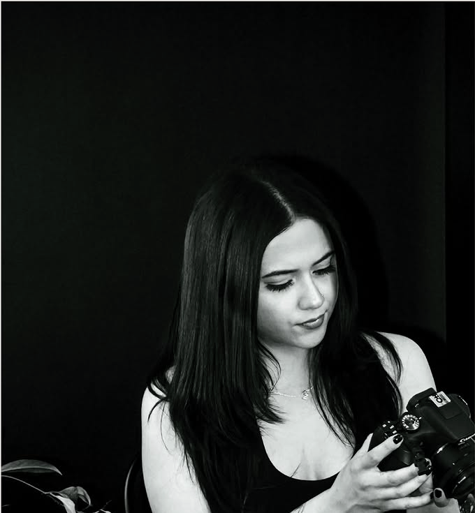Nadine reviewing a camera in the studio